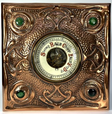 Lot 208 - An Arts and Crafts barometer set in a copper...