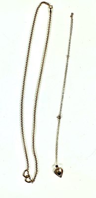 Lot 427 - A 9ct gold chain necklace and a sapphire heart pendant and chain