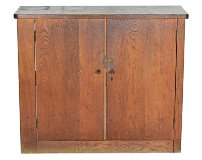 Lot 401 - An oak cabinet in the manner of Heal's,...