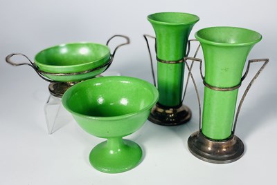 Lot 193 - Four Ruskin green glazed fruit peel lustre...