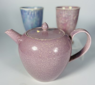 Lot 168 - A Ruskin pink glazed soufflé teapot, 1927, h:...