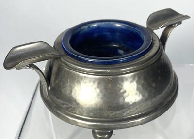 Lot 200 - An arts and crafts Tudric pewter ash tray with...