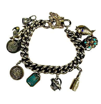 Lot 436 - An early 20th century silver charm bracelet