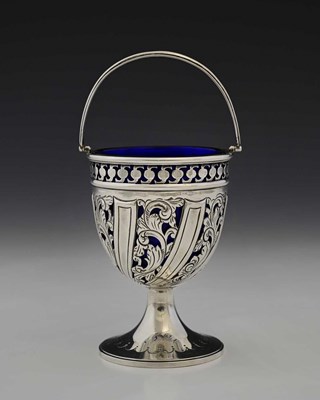 Lot 221 - A late Victorian silver swing handle sugar...