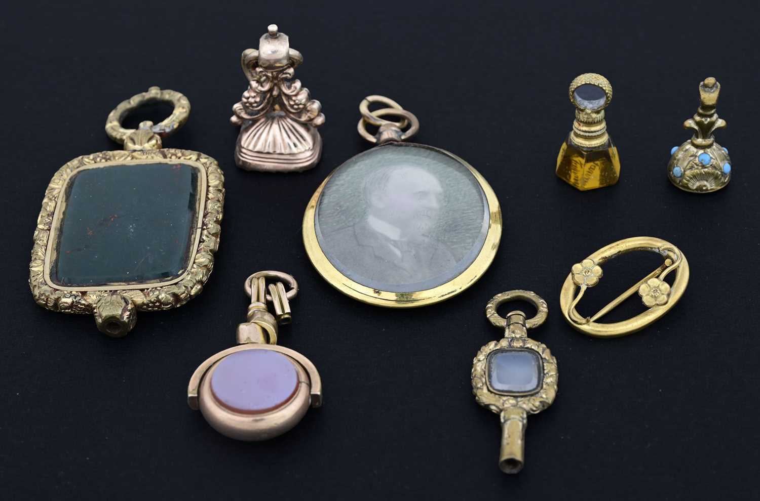 Lot 21 - A collection of gold-coloured metal objects of...