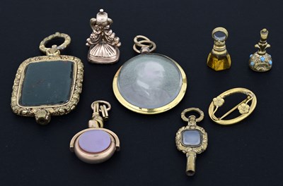 Lot 21 - A collection of gold-coloured metal objects of...