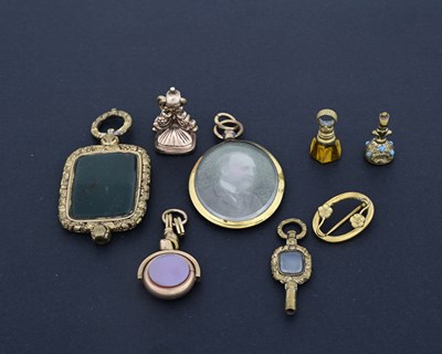 Lot 21 - A collection of gold-coloured metal objects of...