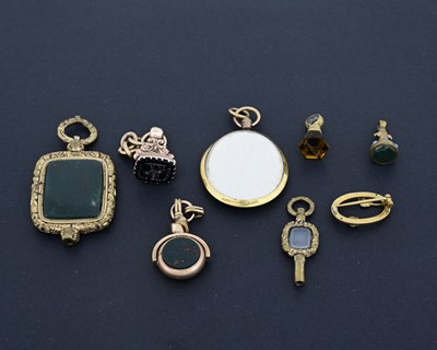 Lot 21 - A collection of gold-coloured metal objects of...