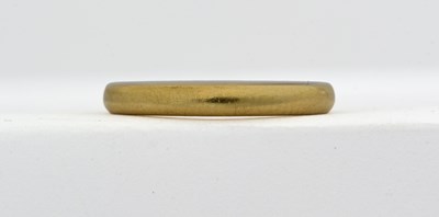 Lot 450 - A 1930s 22ct gold band ring