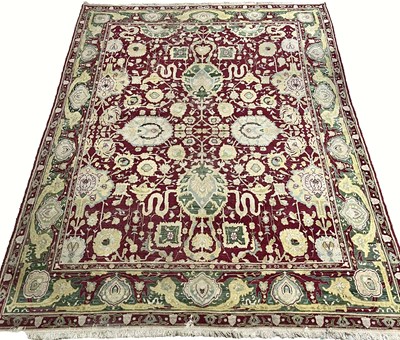 Lot 577 - A large Agra 'jail' rug or carpet, claret...