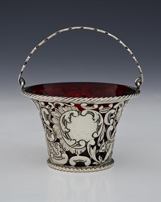 Lot 94 - A Victorian silver swing handle sugar basket...