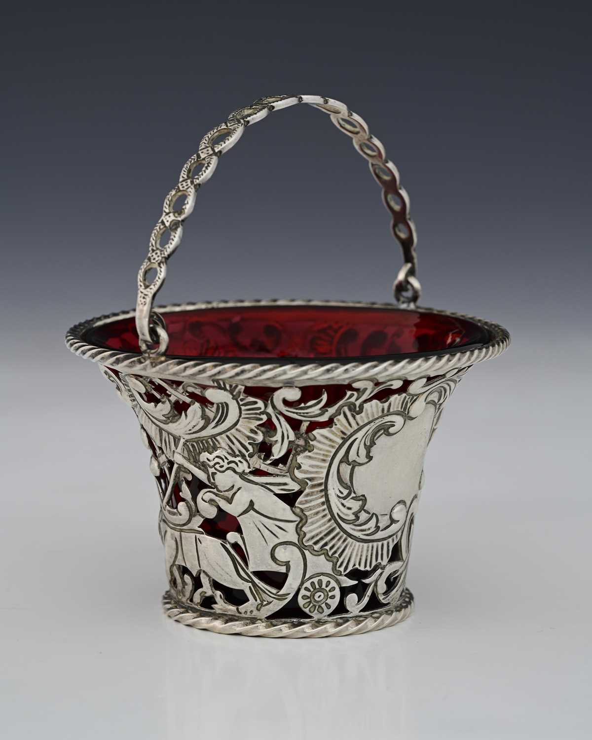 Lot 94 - A Victorian silver swing handle sugar basket...