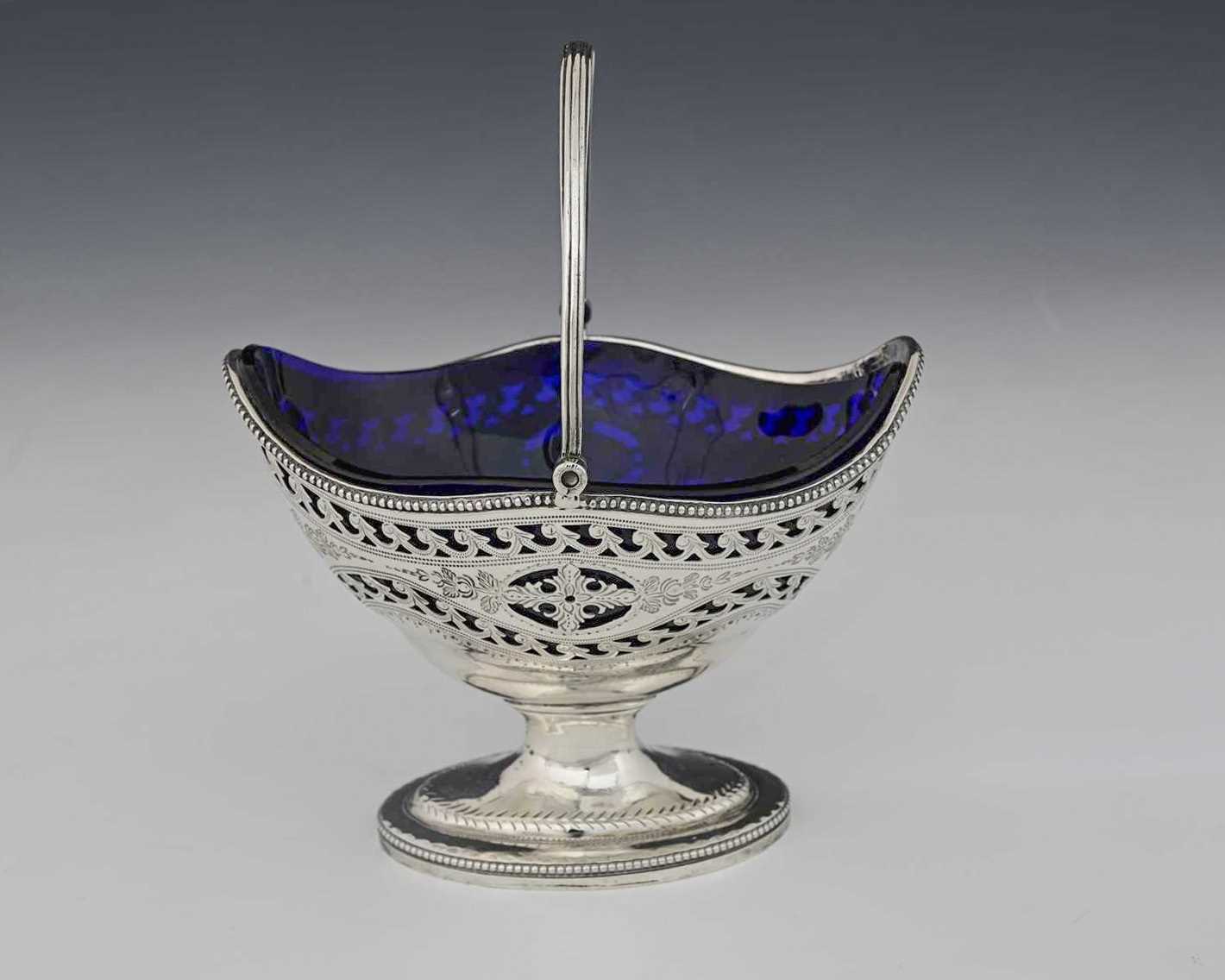 Lot 102 - A George III silver Neoclassical sugar basket,...