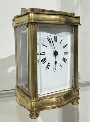 Lot 156 - A small brass carriage timepiece, enamel face...