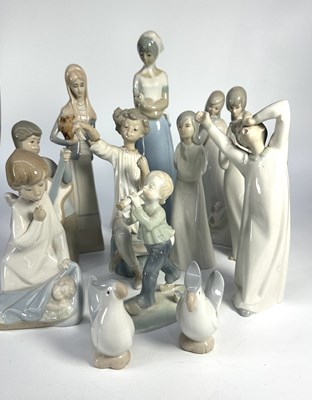 Lot 238 - Four Lladro figurines, depicting a child...