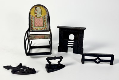 Lot 357 - A miniature or dolls house cast iron fireplace...