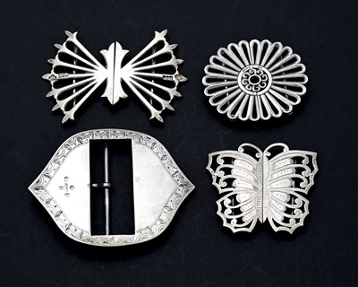 Lot 304 - A group of four silver buckles, to include a...