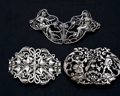Lot 305 - Three early twentieth-century cast silver Arts...