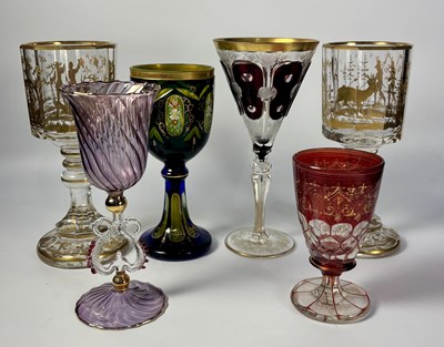 Lot 259 - A pair of bohemian glass goblets, faceted...