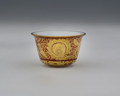 Lot 113 - A Japanese gilt porcelain tea bowl, underglaze...