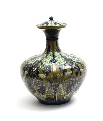 Lot 217 - A Della Robbia Pottery Dutch jar and cover by...