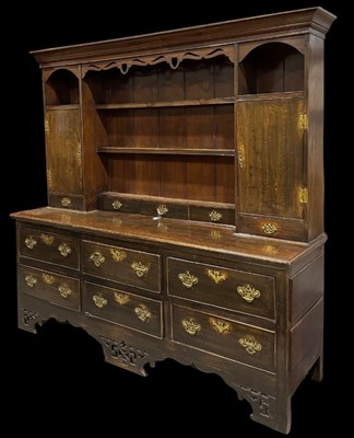 Lot 637 - A Georgian country oak dresser, corniced top...
