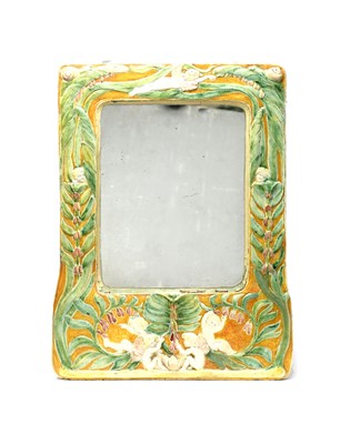 Lot 227 - A rare Della Robbia Pottery wall mirror by...