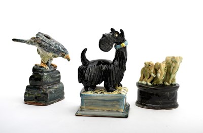 Lot 427 - Willie Cartwright Comical Scottie dog, glazed...