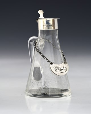 Lot 270 - An Edwardian silver-mounted glass whisky...