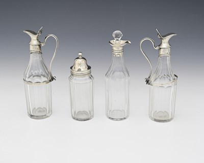 Lot 276 - Four George III silver-mounted glass condiment...