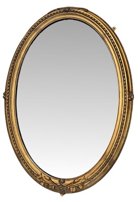 Lot 646 - A 19th-century oval gilt wall mirror, thick...
