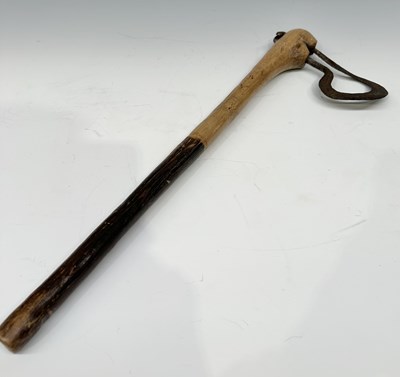 Lot 201 - A tribal club or axe, likely a West African...