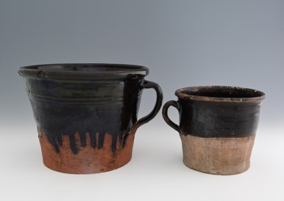 Lot 648 - Two Buckley Ware glazed terracotta ladin cups,...