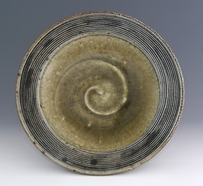Lot 262 - Phil Rogers, a studio pottery plate or charger,...