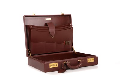 Lot 260 - Cartier, a Must De Cartier Bordeaux leather...