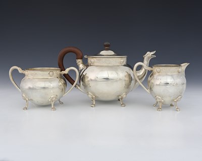 Lot 176 - A George V Scottish silver three-piece tea set,...