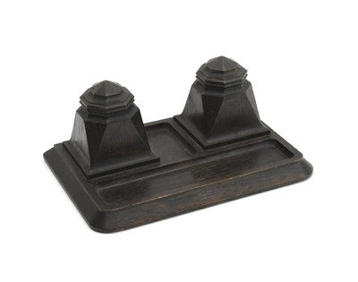 Lot 487 - A Cotswold School oak double inkwell, in the...
