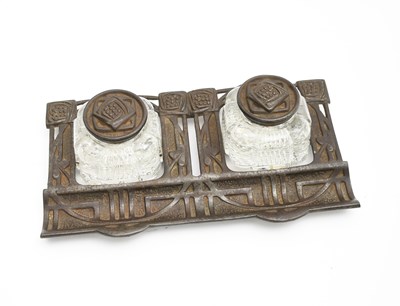 Lot 492 - A Glasgow School cast iron desk inkwell and...