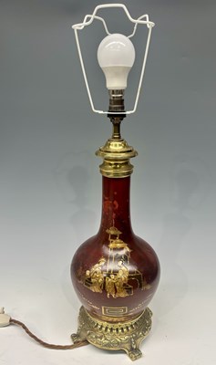 Lot 165 - An oriental red ceramic lamp vase, the body...