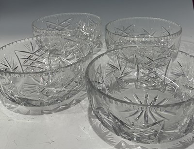 Lot 36 - A set of four heavy cut glass fruit bowls,...