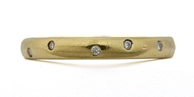 Lot 448 - An 18ct gold brilliant-cut diamond band ring