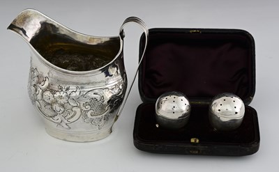 Lot 220 - A George III silver helmet-shaped milk jug, by...