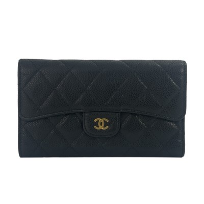 Lot 273 - Chanel, a quilted wallet, featuring a diamond...
