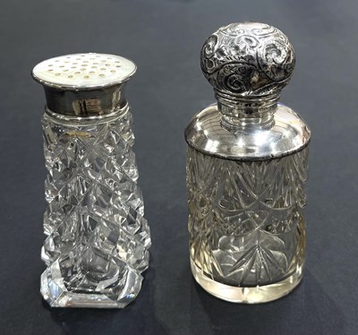Lot 215 - Two hallmarked silver-mounted glass dressing...