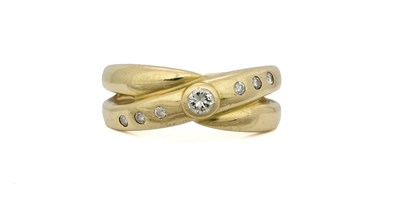 Lot 466 - A gold brilliant-cut diamond crossover ring