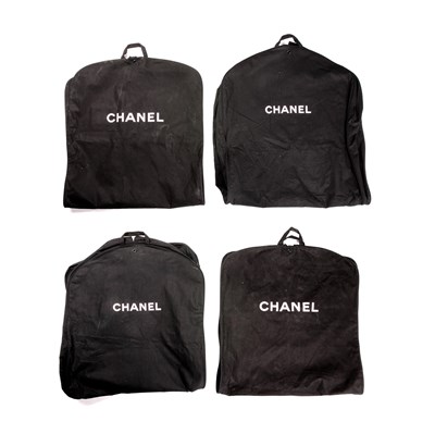 Lot 276 - Chanel, four garment bags, crafted from back...