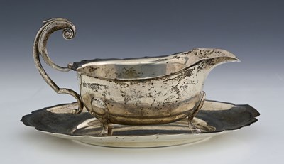 Lot 350 - An Elizabeth II silver sauce boat on stand, by...