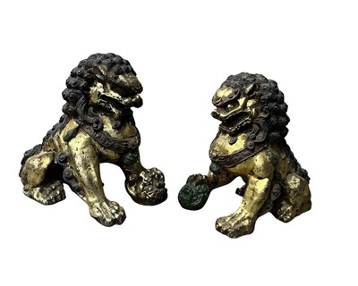 Lot 161 - A pair of painted cast iron lion or Foo Dog,...