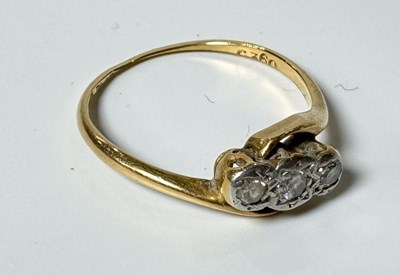 Lot 464 - A gold three stone ring, rubbed marks to...