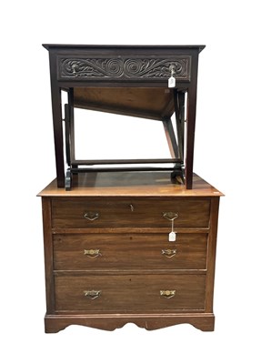 Lot 624 - A small walnut chest of three drawers with...